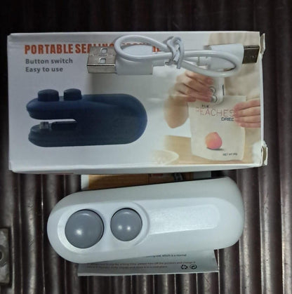 Mini heat sealing machine for food storage in white with USB charging cable and user-friendly buttons