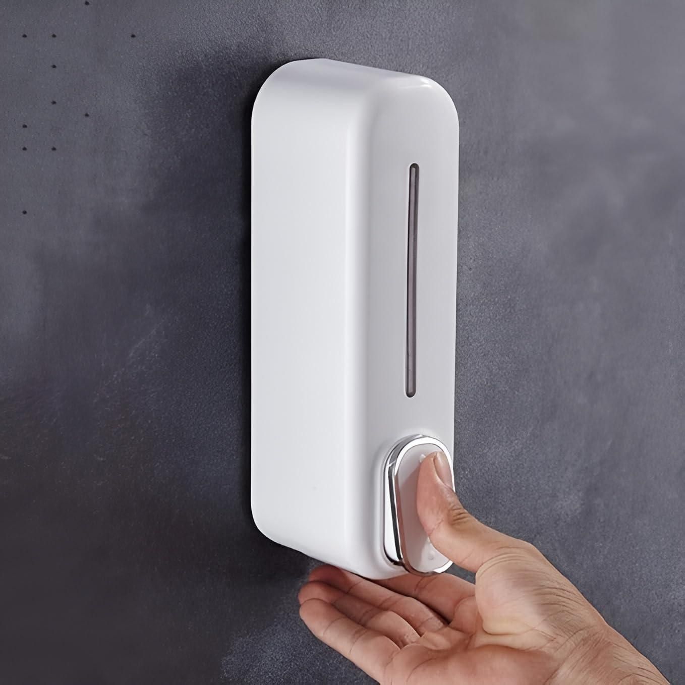 White wall-mounted soap dispenser with a modern design and easy push button for dispensing soap
